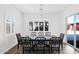An open-concept dining area with a window view to the backyard at 13734 W Harvest Ave, Litchfield Park, AZ 85340