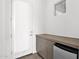 Mud room with outdoor access, cabinet storage and convenient mini refrigerator at 13734 W Harvest Ave, Litchfield Park, AZ 85340