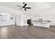 Spacious open-concept area showcasing a modern kitchen and a bright living space with lots of natural light at 13734 W Harvest Ave, Litchfield Park, AZ 85340