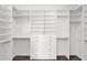 Walk-in closet featuring custom built-ins and ample storage space at 13734 W Harvest Ave, Litchfield Park, AZ 85340