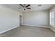 Bedroom with carpet, ceiling fan and a window with white shutters at 1400 E Bethany Home Rd # 27, Phoenix, AZ 85014