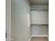 Walk-in closet with built-in shelving and a carpeted floor at 1400 E Bethany Home Rd # 27, Phoenix, AZ 85014