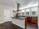Kitchen boasting a center island with cooktop and stainless steel appliances at 1400 E Bethany Home Rd # 27, Phoenix, AZ 85014