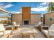 Inviting outdoor lounge area featuring a brick fireplace and stylish seating, perfect for relaxing evenings at 1400 E Bethany Home Rd # 27, Phoenix, AZ 85014