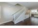 Carpeted staircase with white railing in the living room, connecting the floors at 1400 E Bethany Home Rd # 27, Phoenix, AZ 85014