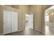 Neutral bedroom with closet space and a view into the entryway and living spaces at 14287 W Cora Ln, Goodyear, AZ 85395