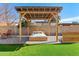 Inviting backyard with a pergola-covered daybed, perfect for relaxation and outdoor living at 1439 N Spencer --, Mesa, AZ 85203