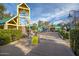 Entrance to an amusement park, featuring a clock tower, ticket booth, and attractions, perfect for Gathering fun at 1622 N 17Th Ave, Phoenix, AZ 85007