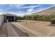 Spacious backyard with a detached garage, gravel landscaping, and a covered patio area for outdoor living at 1622 N 17Th Ave, Phoenix, AZ 85007