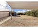 Expansive backyard featuring a covered patio, detached garage, and low-maintenance gravel landscaping at 1622 N 17Th Ave, Phoenix, AZ 85007