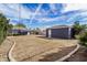 Large backyard featuring gravel landscaping, a patch of grass, and detached garage at 1622 N 17Th Ave, Phoenix, AZ 85007