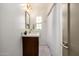 Cozy bathroom featuring a modern vanity, a framed mirror, and a shower with a white curtain at 1622 N 17Th Ave, Phoenix, AZ 85007