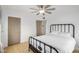 Bright bedroom with neutral walls, wood floors, a modern bed frame, and a ceiling fan at 1622 N 17Th Ave, Phoenix, AZ 85007