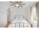 Bright bedroom with wood floors, a modern ceiling fan, and ample natural light at 1622 N 17Th Ave, Phoenix, AZ 85007