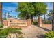 Encanto Park sign surrounded by lush greenery and palm trees on a clear day at 1622 N 17Th Ave, Phoenix, AZ 85007