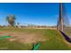 Expansive golf course with lush green fairways, palm trees, and netting, offering a prime recreational setting at 1622 N 17Th Ave, Phoenix, AZ 85007