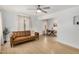 Cozy living room with a comfortable sofa and open access to the dining area at 1622 N 17Th Ave, Phoenix, AZ 85007