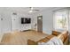 Spacious living room with ample natural light, wood floors, and a modern entertainment center at 1622 N 17Th Ave, Phoenix, AZ 85007