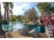 Picturesque Encanto Park pond featuring a small waterfall, rocks, and greenery at 1622 N 17Th Ave, Phoenix, AZ 85007