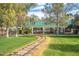 A charming park train travels along a winding track through lush green lawns at Encanto Park at 1622 N 17Th Ave, Phoenix, AZ 85007