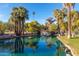 Beautiful view of a pond with palm trees and a bridge in the background, offering a serene and tropical escape at 1622 N 17Th Ave, Phoenix, AZ 85007