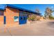 Exterior view of a pool entrance with brick facade and blue doors, ideal for community recreation at 1622 N 17Th Ave, Phoenix, AZ 85007
