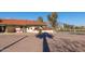 Exterior view of the pro shop with a terracotta tile roof, surrounded by lush landscaping and golf course views at 1622 N 17Th Ave, Phoenix, AZ 85007