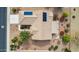Aerial view of home featuring desert landscaping, a tile roof, solar panels, and a covered patio at 17228 N Estrella Vista Dr, Surprise, AZ 85374