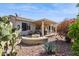 Inviting backyard with a covered patio and a cozy fire pit, perfect for outdoor entertaining in a serene setting at 17228 N Estrella Vista Dr, Surprise, AZ 85374
