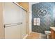Bathroom view showcasing a glass shower, decorative wall, and tiled flooring at 17228 N Estrella Vista Dr, Surprise, AZ 85374