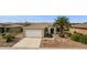 Charming single-story home with a two-car garage, complemented by a well-maintained desert landscape at 17228 N Estrella Vista Dr, Surprise, AZ 85374