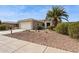 Charming home featuring desert landscaping, a two-car garage, and a welcoming entrance at 17228 N Estrella Vista Dr, Surprise, AZ 85374