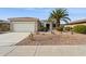 Charming home featuring desert landscaping, a two-car garage, and a welcoming entrance at 17228 N Estrella Vista Dr, Surprise, AZ 85374