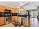 Charming kitchen featuring wooden cabinets, stainless steel appliances, and granite countertops at 17228 N Estrella Vista Dr, Surprise, AZ 85374