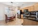 Charming kitchen with wooden cabinets, stainless steel appliances, and an adjacent dining area at 17228 N Estrella Vista Dr, Surprise, AZ 85374