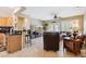 Inviting living room showcasing tile flooring, a breakfast bar, and an open floor plan at 17228 N Estrella Vista Dr, Surprise, AZ 85374