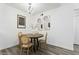 Elegant dining area with a round table, stylish chairs, and modern lighting at 1942 S Emerson -- # 222, Mesa, AZ 85210