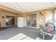 Relaxing screened porch features string lights, and a view of the outside at 19613 N Signal Butte Cir, Sun City, AZ 85373