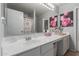 Well-lit bathroom with a large mirror, white vanity, and ample counter space at 1993 E 37Th Ave, Apache Junction, AZ 85119