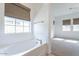 Inviting bathtub nook illuminated by large window at 2117 E Oriole Dr, Gilbert, AZ 85297