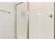 Modern bathroom shower featuring white subway tile and sleek glass door at 21960 E Saddle Ct, Queen Creek, AZ 85142
