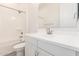 A stylish bathroom featuring a white vanity and a shower-tub combination at 21960 E Saddle Ct, Queen Creek, AZ 85142