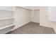 Walk-in closet with carpet and shelving, perfect for storage at 21960 E Saddle Ct, Queen Creek, AZ 85142