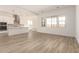 A spacious living room flows into the kitchen with an open floorplan at 21960 E Saddle Ct, Queen Creek, AZ 85142