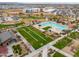 An aerial view features the community pool, landscaping, shade structures, and picnic space at 22651 E Via Del Verde --, Queen Creek, AZ 85142