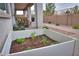This backyard has a raised planter bed, patio seating, desert landscaping, and brick paver patio at 22651 E Via Del Verde --, Queen Creek, AZ 85142