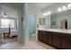 Bright bathroom with a double sink vanity and tiled floors at 22651 E Via Del Verde --, Queen Creek, AZ 85142