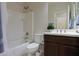 Clean bathroom features a shower-tub combo, toilet, mirror, sink, and dark wood vanity cabinet at 22651 E Via Del Verde --, Queen Creek, AZ 85142