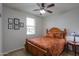 Well-lit bedroom featuring a bed with decorative pillows and a ceiling fan at 22651 E Via Del Verde --, Queen Creek, AZ 85142