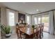 Bright dining room featuring a large wooden table and natural light at 22651 E Via Del Verde --, Queen Creek, AZ 85142